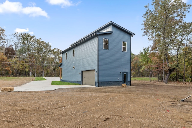 view of side of home with a garage