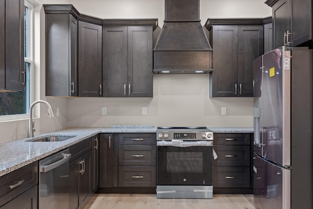 kitchen featuring dark brown cabinetry, appliances with stainless steel finishes, and custom exhaust hood