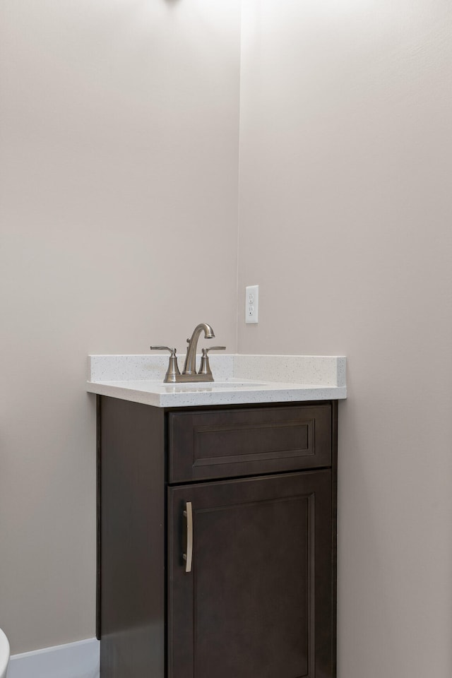 bathroom with toilet and vanity