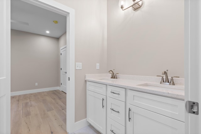 bathroom featuring vanity and hardwood / wood-style floors