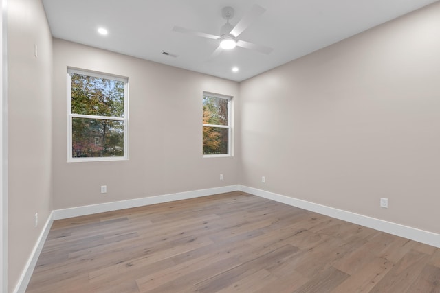 unfurnished room featuring light wood-type flooring and ceiling fan