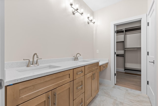 bathroom featuring vanity and wood-type flooring