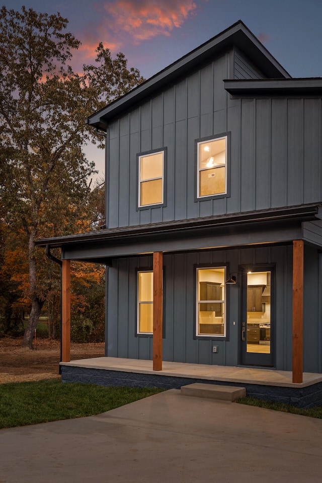 view of back house at dusk