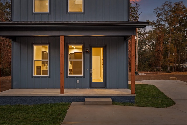 exterior entry at dusk with a porch