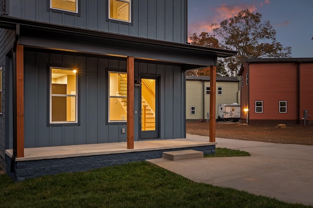 view of exterior entry at dusk