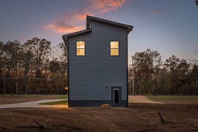 view of property exterior at dusk