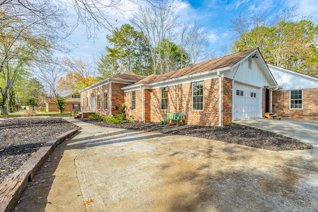 view of side of property with a garage