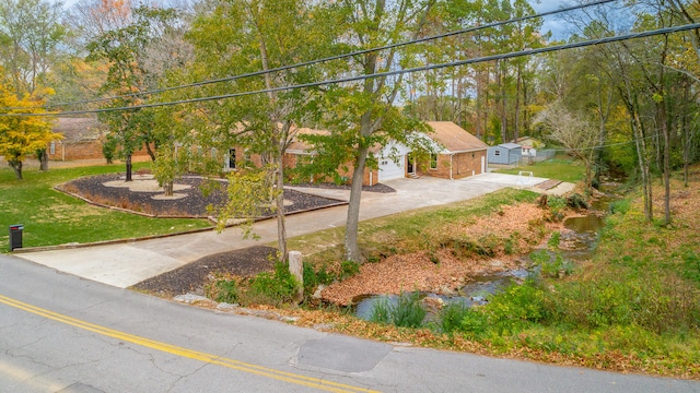 view of front of house with a garage and a front yard