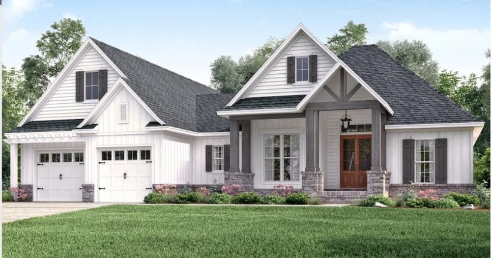 view of front of property featuring a front yard, a porch, french doors, and a garage