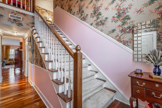 stairway featuring hardwood / wood-style flooring