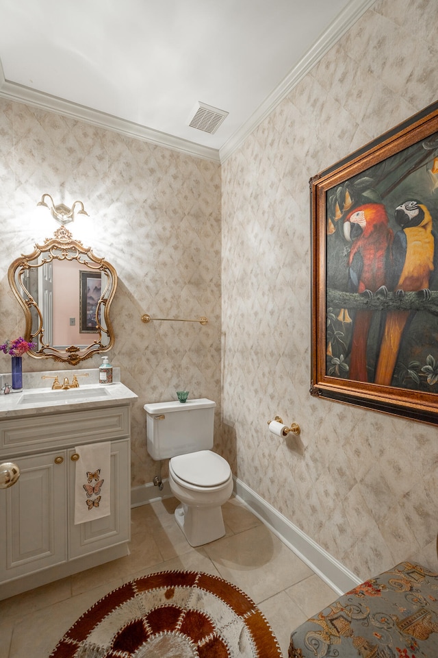 bathroom featuring vanity, tile patterned floors, toilet, and crown molding