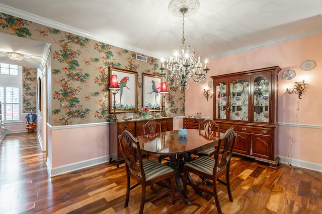 dining space with a chandelier, dark hardwood / wood-style flooring, and ornamental molding