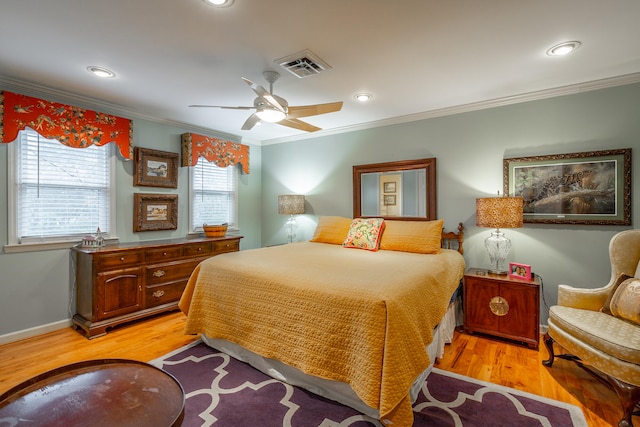 bedroom with ornamental molding, light wood-type flooring, and ceiling fan