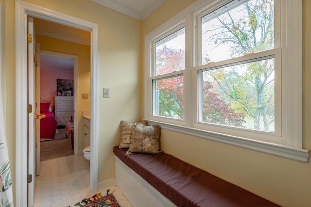 interior space featuring light tile patterned flooring and crown molding