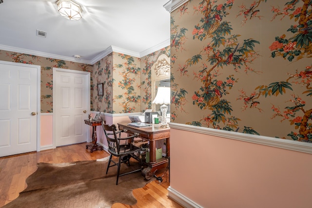 office space with wood-type flooring and ornamental molding