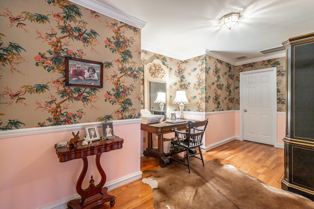 office area featuring wood-type flooring and ornamental molding