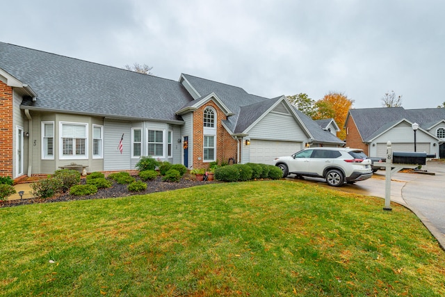 view of front facade with a garage and a front yard