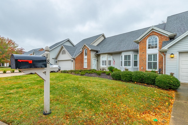 view of front property with a garage and a front yard