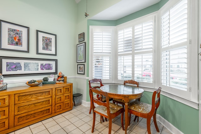 dining space with light tile patterned floors