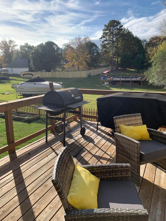 wooden terrace with a yard