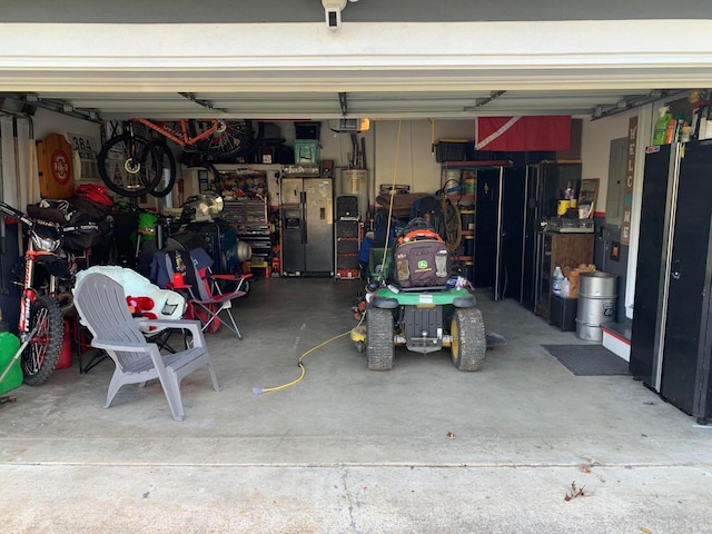 garage with stainless steel fridge with ice dispenser