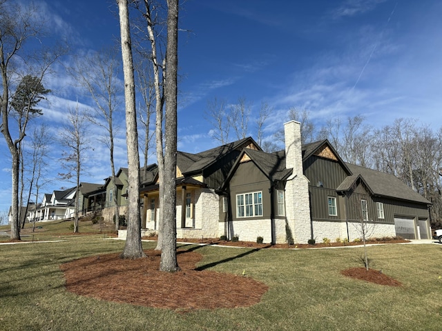 view of front of house with a garage and a front lawn