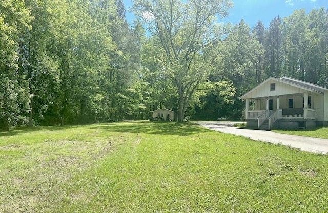 view of yard featuring a porch