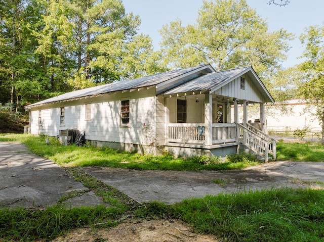 view of property exterior featuring covered porch