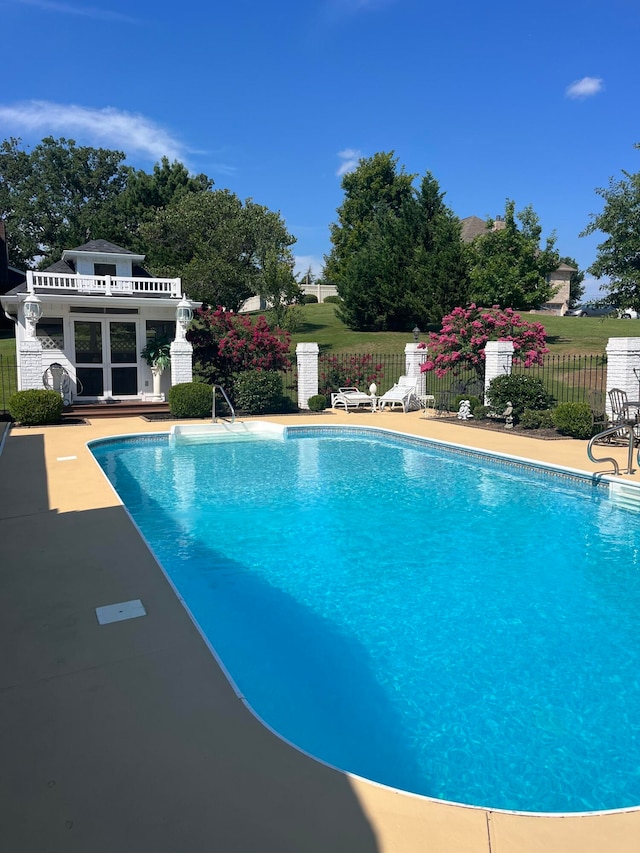 view of pool featuring a patio and an outdoor structure