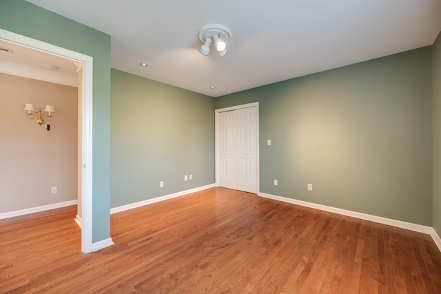 empty room featuring hardwood / wood-style flooring