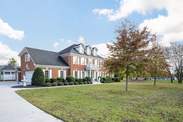 view of front of property featuring a garage and a front yard