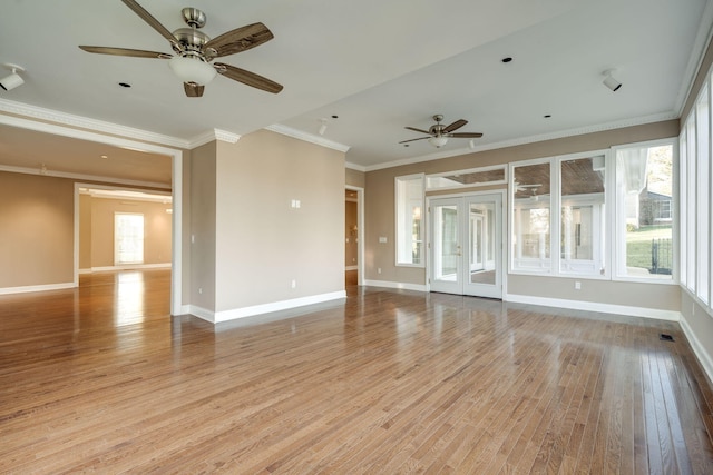 unfurnished living room with french doors, light wood-type flooring, ceiling fan, and ornamental molding