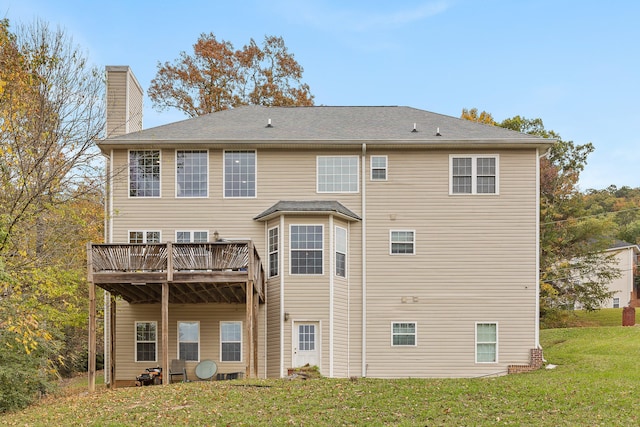 back of house featuring a yard