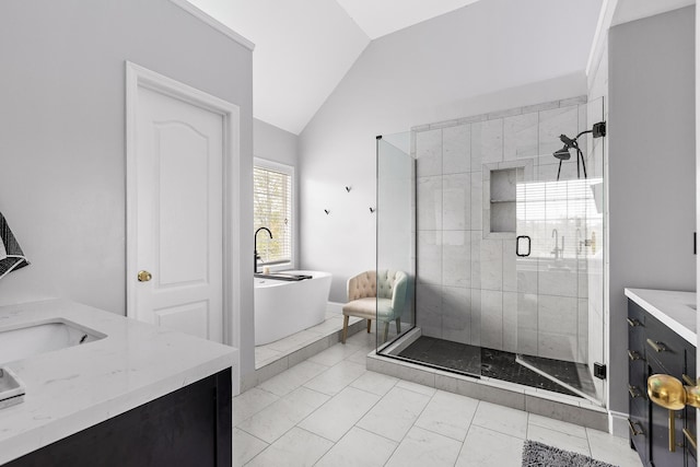 bathroom with tile patterned floors, vanity, lofted ceiling, and separate shower and tub