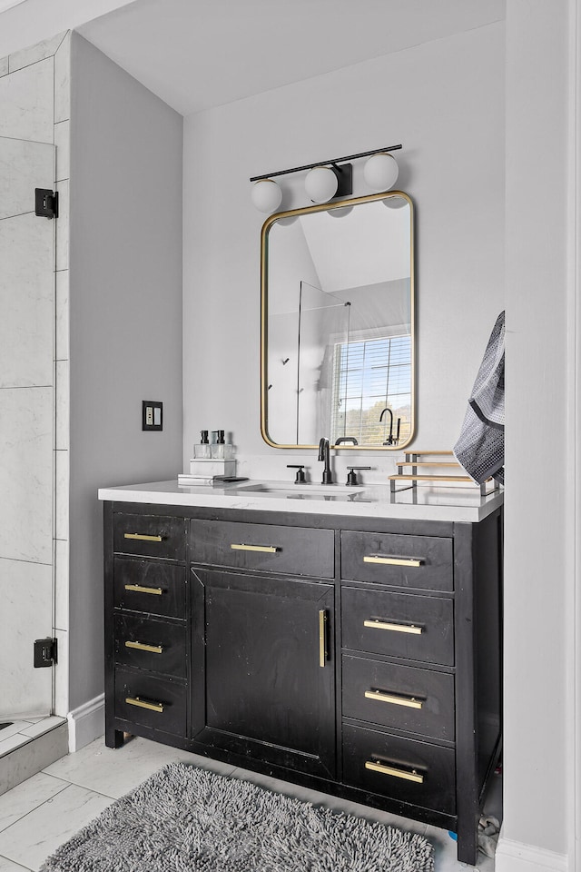 bathroom with walk in shower and vanity