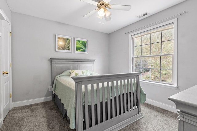 bedroom with ceiling fan and carpet floors