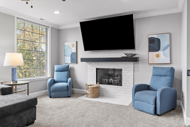 carpeted living room with a fireplace, plenty of natural light, and crown molding