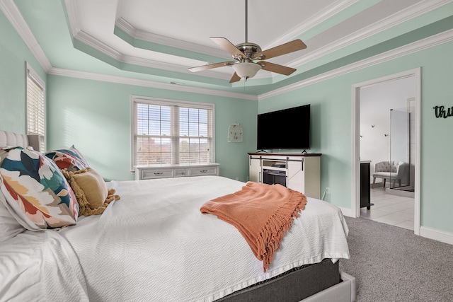 bedroom with ceiling fan, light carpet, a raised ceiling, and ornamental molding