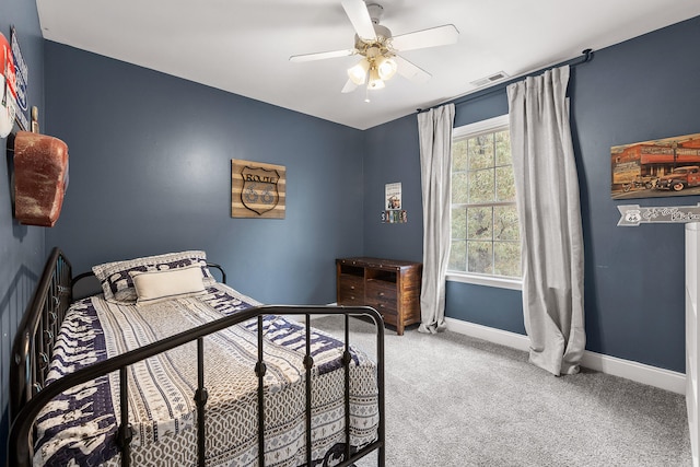 bedroom featuring ceiling fan and carpet