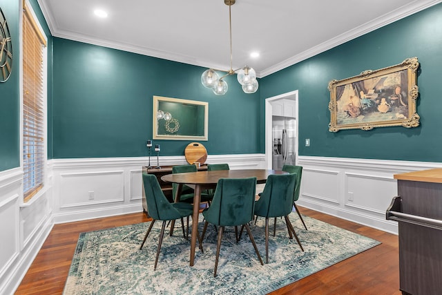 dining area featuring dark hardwood / wood-style flooring and crown molding