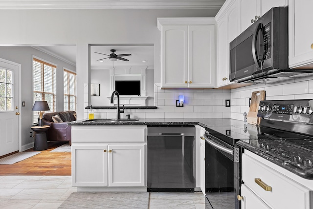 kitchen featuring black appliances, ornamental molding, white cabinetry, sink, and light hardwood / wood-style flooring