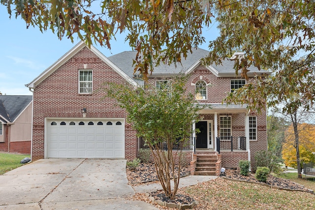 front of property featuring a garage and a porch