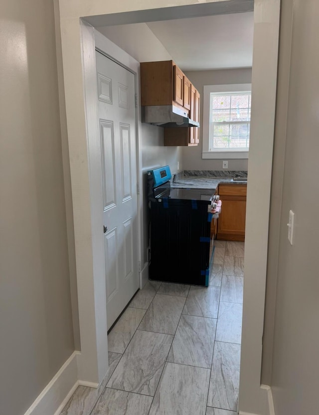 kitchen with black range with electric cooktop