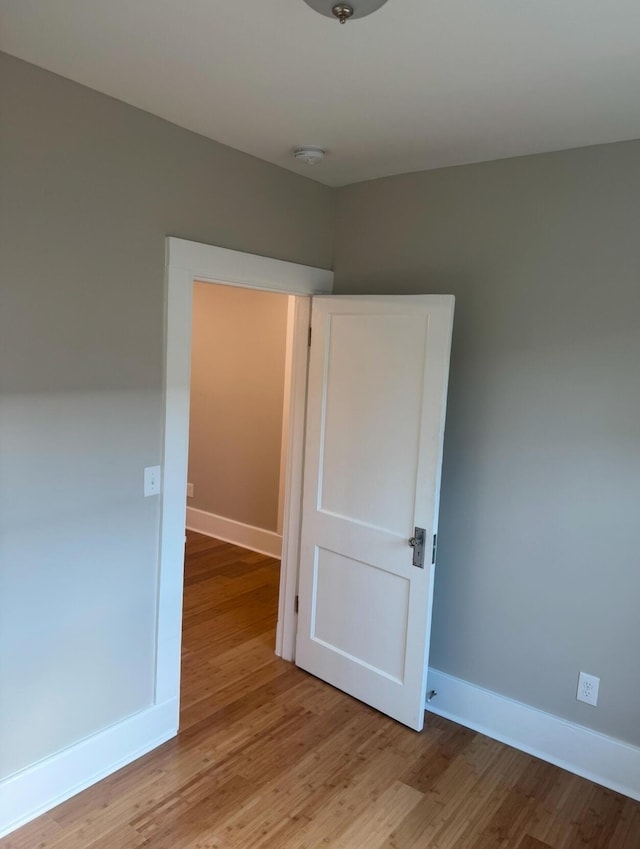 spare room featuring light hardwood / wood-style flooring