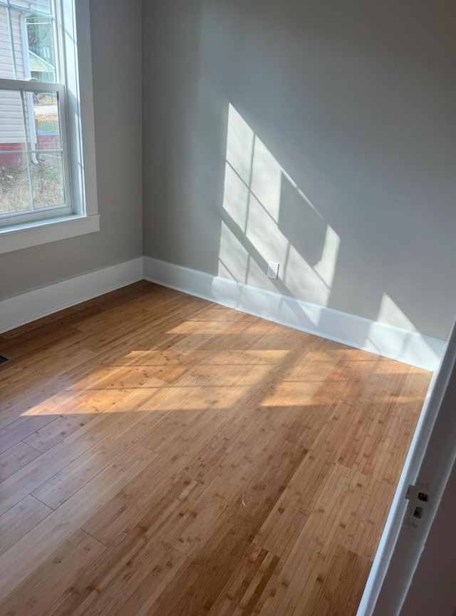 unfurnished room featuring light hardwood / wood-style flooring