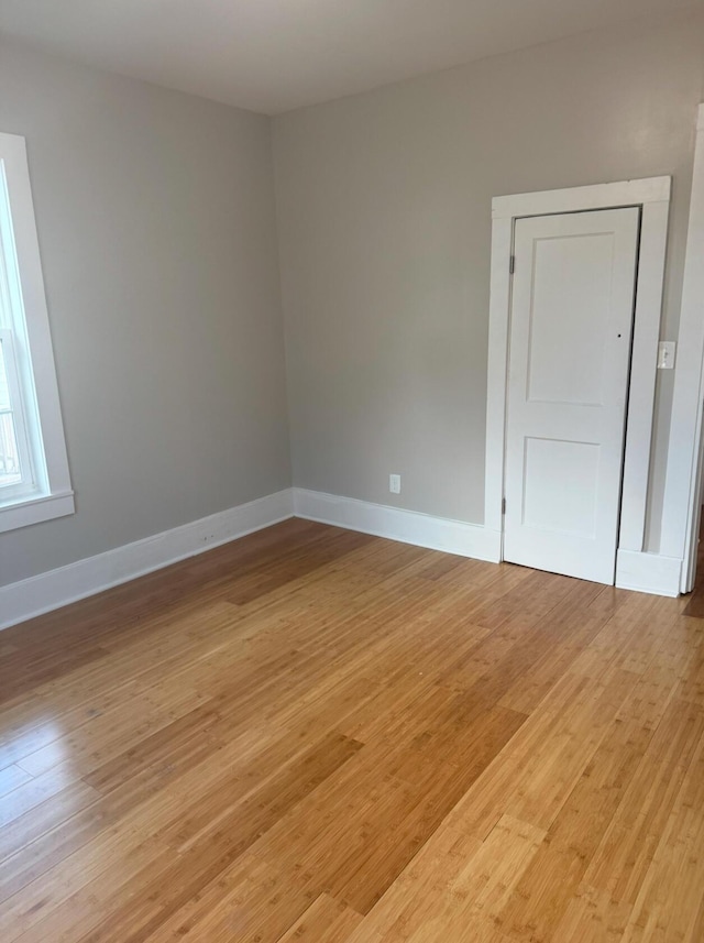 spare room featuring light wood-type flooring