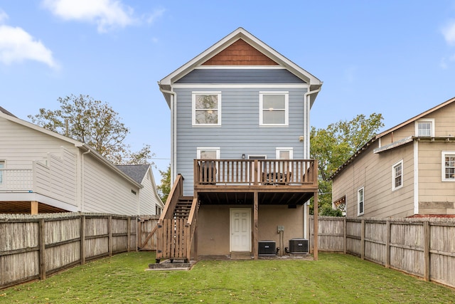 rear view of property featuring central air condition unit, a wooden deck, and a lawn