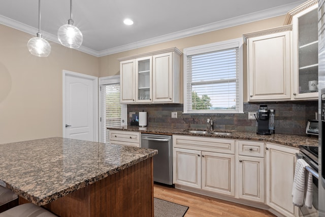 kitchen with stainless steel appliances, a wealth of natural light, and tasteful backsplash