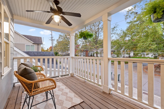 wooden deck featuring ceiling fan