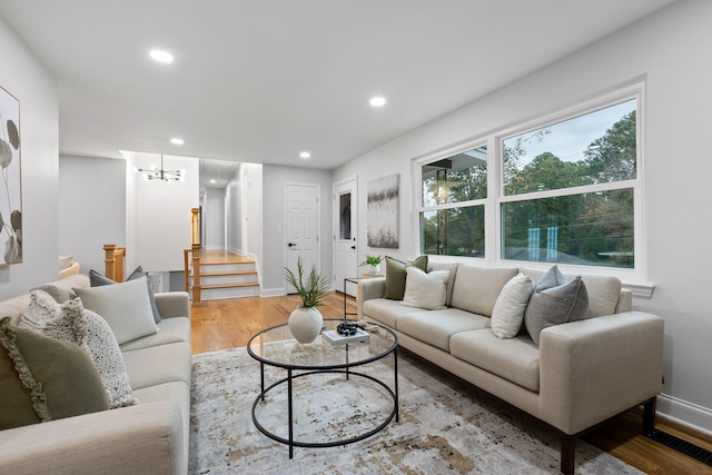 living room featuring hardwood / wood-style floors and a chandelier